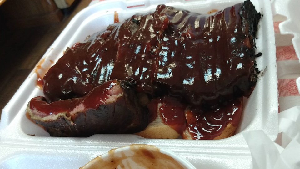 A casual barbecue spread on a table.